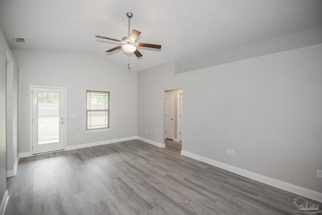 3620 Ranch Dr, Crestview, FL 32539 - empty room featuring a ceiling fan, lofted ceiling, wood finished floors, and baseboards