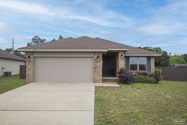 3620 Ranch Dr, Crestview, FL 32539 - view of front facade with concrete driveway, a garage, brick siding, roof with shingles, and central AC unit