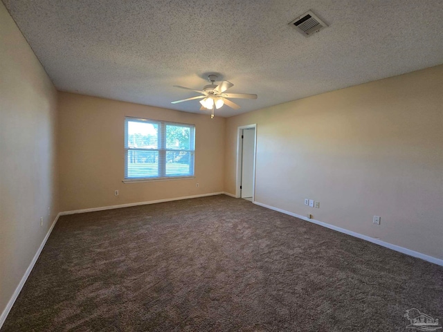 carpeted empty room featuring a textured ceiling and ceiling fan