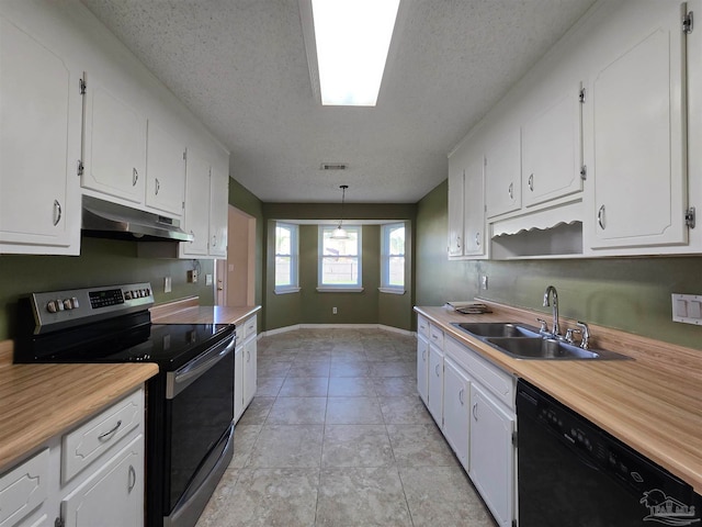 kitchen with black dishwasher, sink, stainless steel electric range, white cabinets, and a textured ceiling