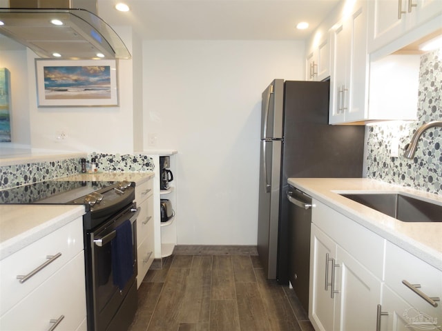 kitchen featuring island range hood, a sink, white cabinetry, black electric range, and light countertops