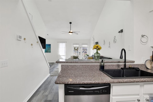 kitchen with sink, dishwasher, ceiling fan, white cabinetry, and dark hardwood / wood-style floors