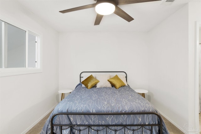 bedroom with ceiling fan and carpet flooring