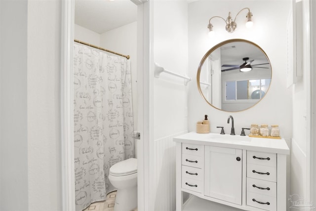 bathroom with vanity, ceiling fan, and toilet