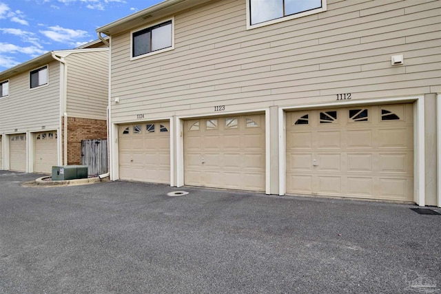 view of property exterior with a garage