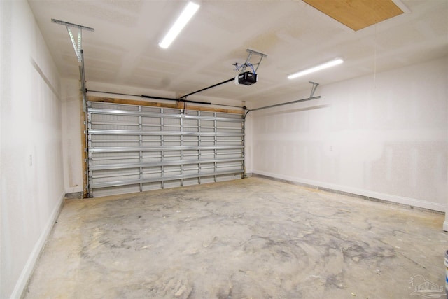 5742 San Blas St, Milton, FL 32583 - garage featuring baseboards and a garage door opener
