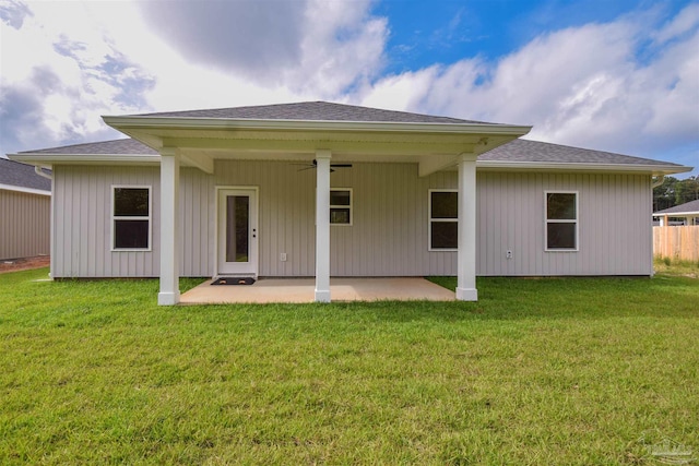 5742 San Blas St, Milton, FL 32583 - back of house featuring ceiling fan, a patio area, a lawn, and roof with shingles