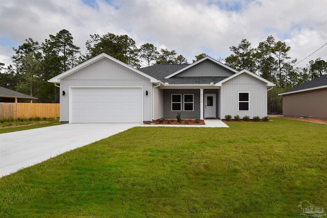 5742 San Blas St, Milton, FL 32583 - view of front facade featuring a garage, concrete driveway, and roof with shingles