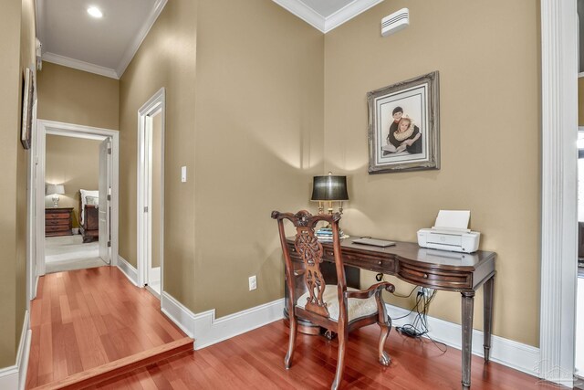 office with crown molding and hardwood / wood-style floors