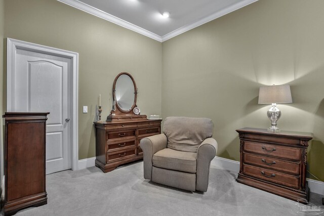 sitting room with light colored carpet and ornamental molding