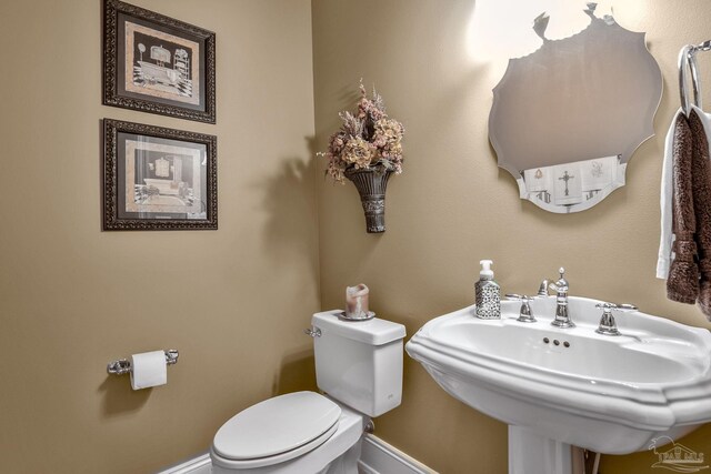 bathroom with sink and toilet