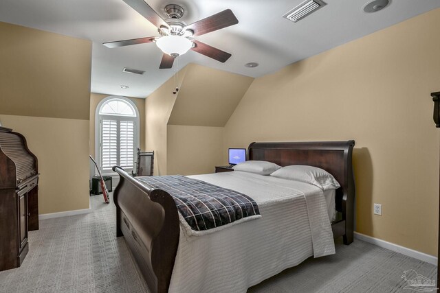 carpeted bedroom featuring lofted ceiling and ceiling fan