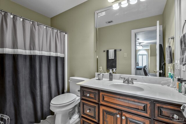 bathroom with tile patterned floors, vanity, and toilet