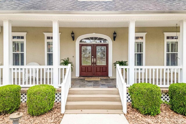 property entrance featuring french doors