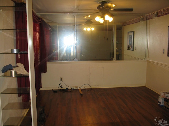 interior space featuring wood-type flooring and ceiling fan