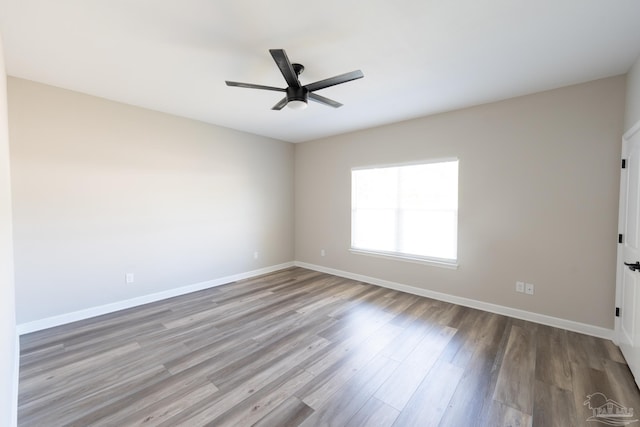 9901 Raymar St Unit A, Pensacola, FL 32534 - spare room with wood finished floors, ceiling fan, and baseboards