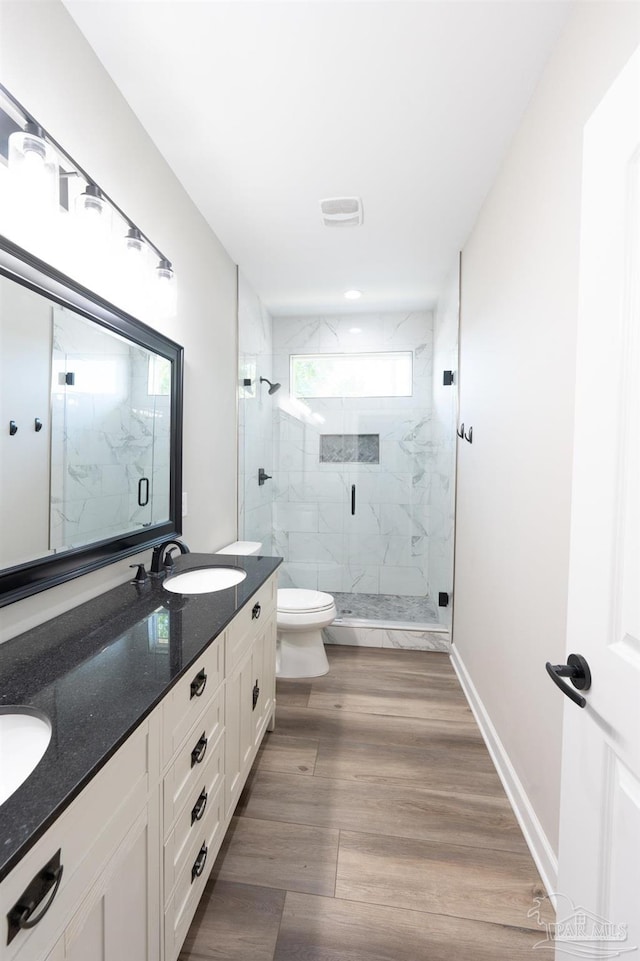 9901 Raymar St Unit A, Pensacola, FL 32534 - bathroom with visible vents, toilet, a sink, a marble finish shower, and double vanity