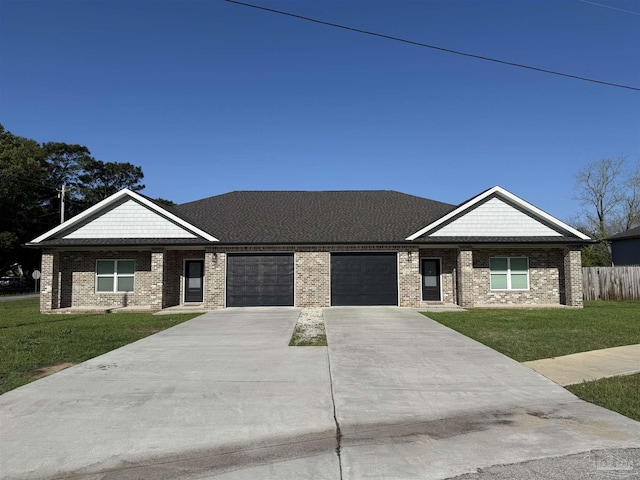 9901 Raymar St Unit A, Pensacola, FL 32534 - view of front of home featuring concrete driveway, an attached garage, brick siding, and a front lawn