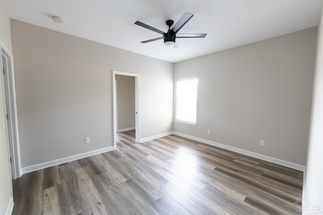 9901 Raymar St Unit A, Pensacola, FL 32534 - unfurnished bedroom with wood finished floors, baseboards, and a ceiling fan