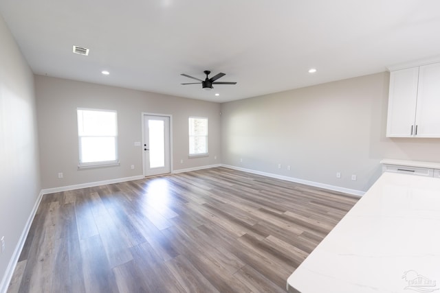 9901 Raymar St Unit A, Pensacola, FL 32534 - unfurnished living room with baseboards, recessed lighting, visible vents, ceiling fan, and wood finished floors