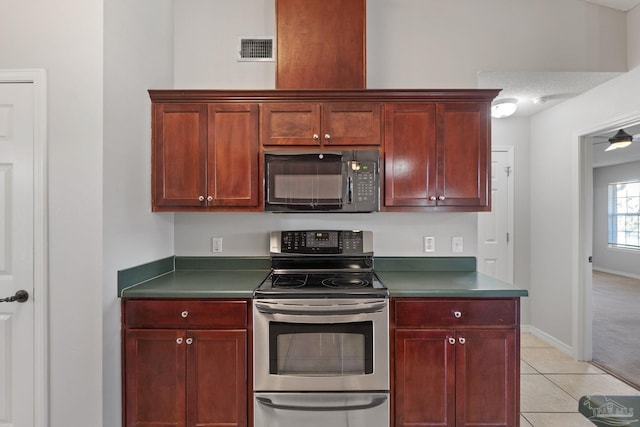 kitchen featuring dark countertops, visible vents, stainless steel range with electric cooktop, dark brown cabinets, and black microwave