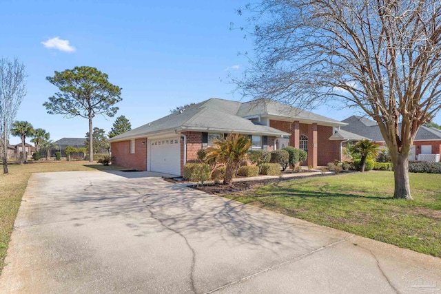 ranch-style house with a garage, driveway, a front yard, and brick siding