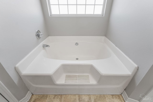 full bath with a garden tub and a wealth of natural light