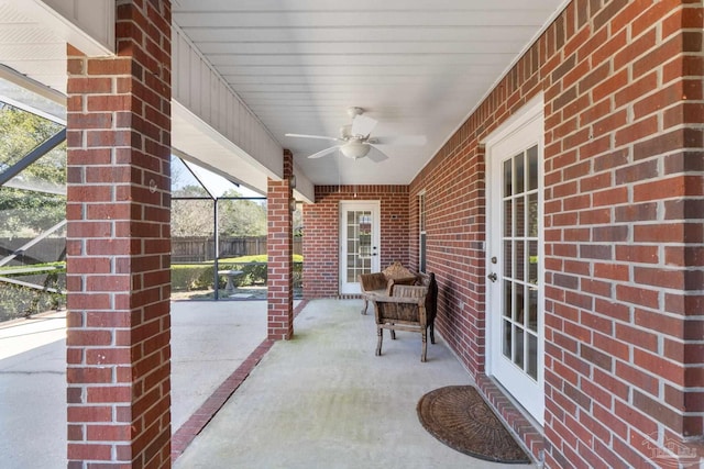 view of patio / terrace featuring ceiling fan and fence