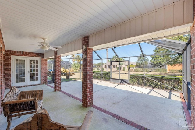 view of patio / terrace featuring a lanai, ceiling fan, and french doors