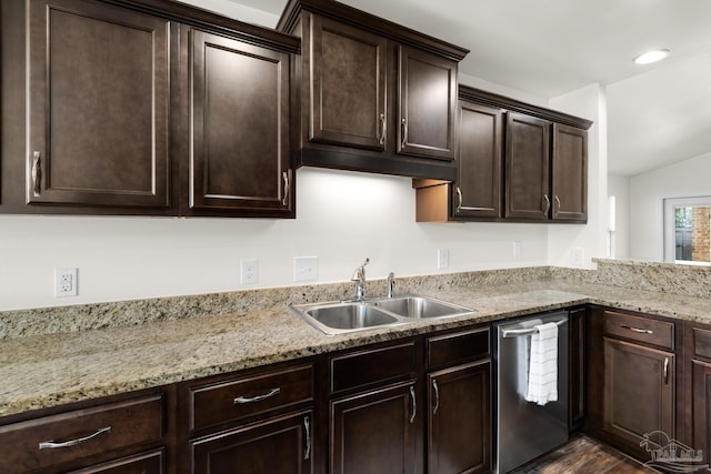 kitchen with light stone counters, stainless steel dishwasher, a sink, and dark brown cabinetry