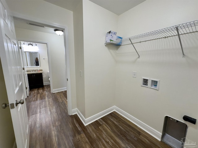 laundry room with laundry area, baseboards, visible vents, dark wood-style flooring, and washer hookup