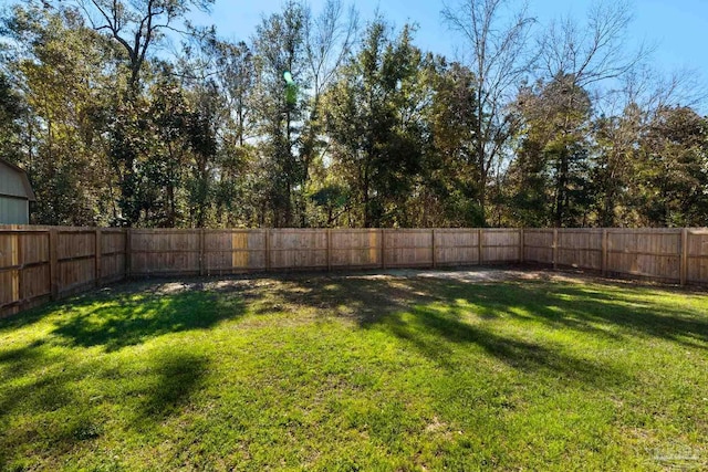 view of yard featuring a fenced backyard