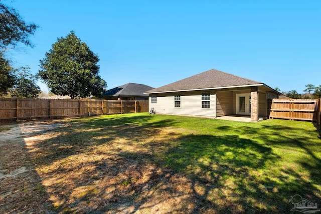 view of yard with a patio area and a fenced backyard