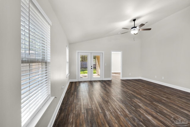 unfurnished living room with baseboards, a ceiling fan, lofted ceiling, dark wood-type flooring, and french doors