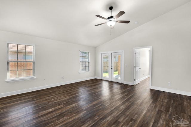 unfurnished room featuring baseboards, dark wood finished floors, ceiling fan, french doors, and high vaulted ceiling