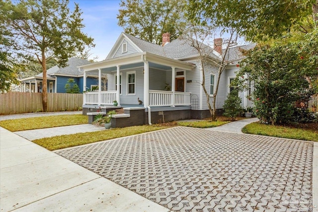 bungalow-style house featuring covered porch