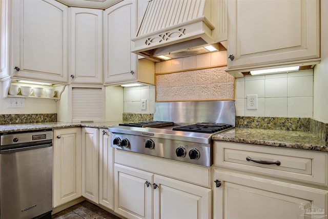 607 Goodwill Cir, Silas, AL 36919 - kitchen featuring premium range hood, stainless steel gas stovetop, decorative backsplash, and light stone counters