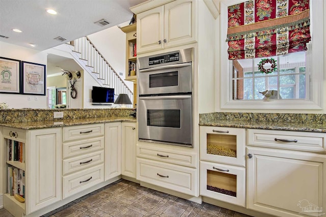 607 Goodwill Cir, Silas, AL 36919 - kitchen featuring stainless steel double oven, open shelves, healthy amount of natural light, dark stone countertops, and recessed lighting