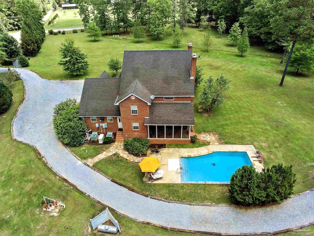 607 Goodwill Cir, Silas, AL 36919 - swimming pool with a yard, a sunroom, and a patio