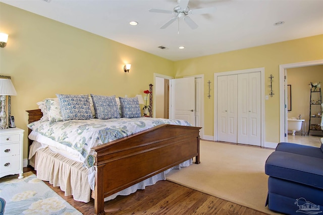 607 Goodwill Cir, Silas, AL 36919 - bedroom with multiple closets, recessed lighting, light wood-style floors, a ceiling fan, and baseboards