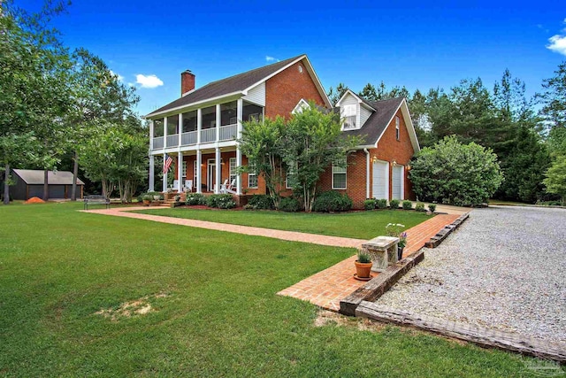 607 Goodwill Cir, Silas, AL 36919 - rear view of house featuring brick siding, covered porch, a chimney, and a lawn