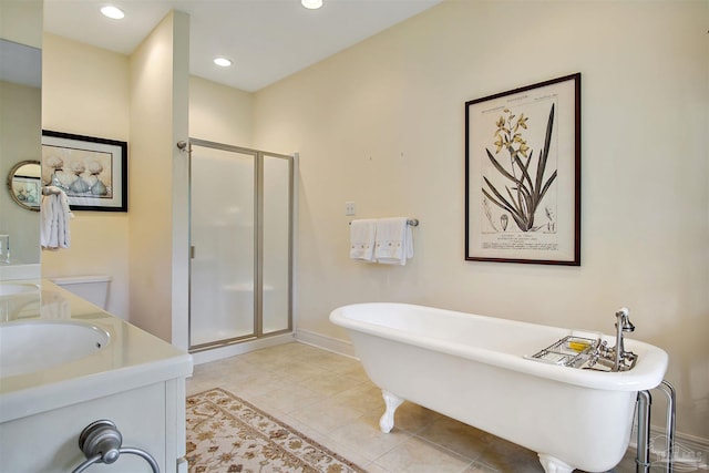 607 Goodwill Cir, Silas, AL 36919 - full bath with a shower stall, double vanity, a freestanding tub, baseboards, and tile patterned flooring