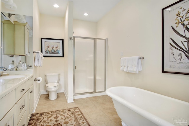 607 Goodwill Cir, Silas, AL 36919 - full bath with a stall shower, toilet, vanity, tile patterned flooring, and a soaking tub