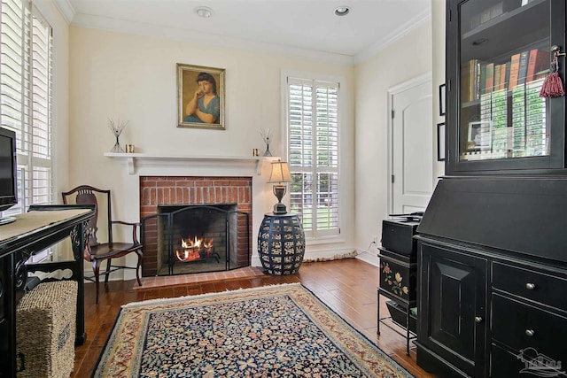 607 Goodwill Cir, Silas, AL 36919 - living room with crown molding, wood finished floors, a brick fireplace, baseboards, and recessed lighting