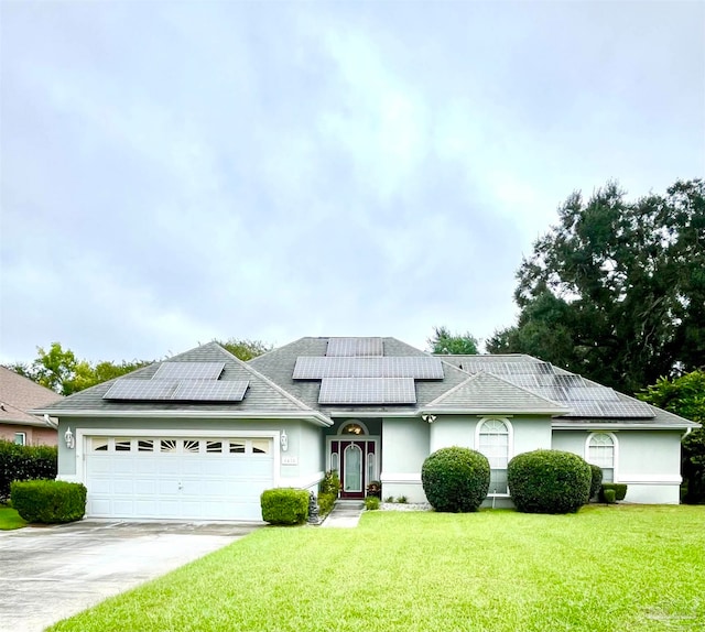 single story home with solar panels and a front lawn