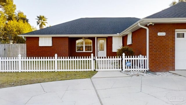 ranch-style home featuring a garage