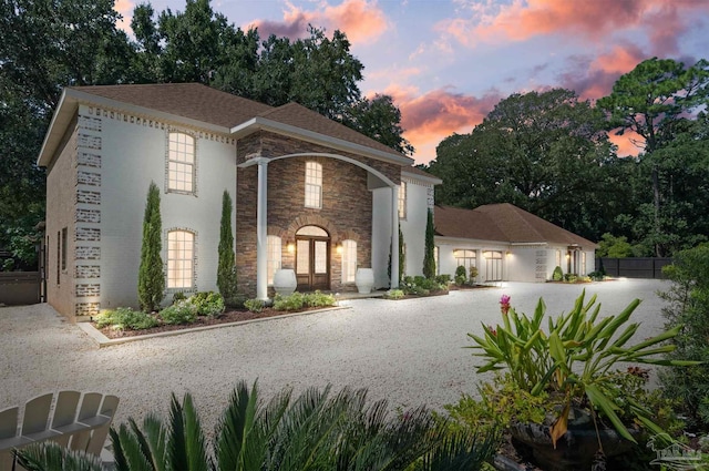 457 Boone Ln, Fairhope, AL 36532 - view of front of home featuring stone siding, driveway, and french doors