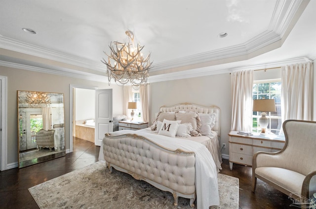 bedroom featuring dark tile patterned flooring, a raised ceiling, connected bathroom, crown molding, and a chandelier