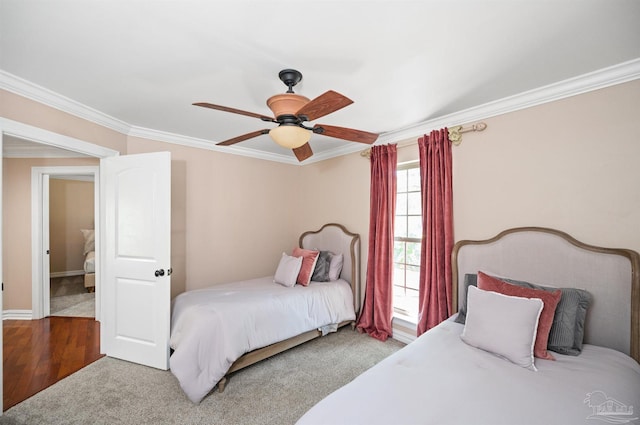 457 Boone Ln, Fairhope, AL 36532 - carpeted bedroom featuring ornamental molding, a ceiling fan, baseboards, and wood finished floors