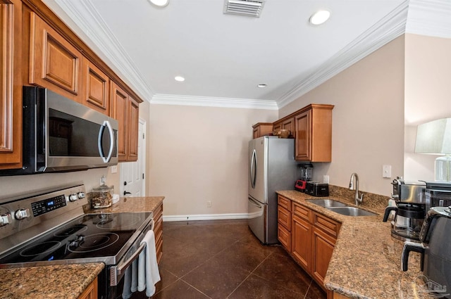 kitchen with dark tile patterned flooring, appliances with stainless steel finishes, sink, light stone countertops, and crown molding